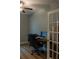 Bright office space with french doors, wood-look flooring, ceiling fan, and a comfortable office chair at 513 Forest Ln, Canton, GA 30114