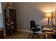 Office features a dark wood bookshelf and a desk with a light for a cozy workspace at 513 Forest Ln, Canton, GA 30114