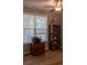 An office with a ceiling fan and a window with blinds lets in natural light at 513 Forest Ln, Canton, GA 30114