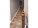 Carpeted staircase with wooden handrail and white risers leading to the upper level at 513 Forest Ln, Canton, GA 30114
