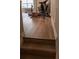 Carpeted staircase leading to the bonus room featuring hard wood floors and exercise equipment at 513 Forest Ln, Canton, GA 30114