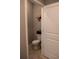 Powder room displaying neutral paint and a butterfly wall art decoration at 513 Forest Ln, Canton, GA 30114
