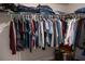 Organized walk-in closet with hanging clothes, folded items, and ample storage space at 513 Forest Ln, Canton, GA 30114