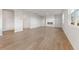 Spacious living room features wood-look floors, bright white walls, and a modern fireplace at 2635 Mourning Dove Dr. (Lot 48), Grayson, GA 30017