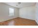 Bright bedroom with laminate floors, neutral walls, and window letting in natural light at 6715 Biscayne Blvd, Rex, GA 30273