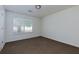 The bedroom features neutral carpet and a window for natural light at 6715 Biscayne Blvd, Rex, GA 30273