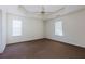 Large main bedroom with a ceiling fan and carpeted floors at 6715 Biscayne Blvd, Rex, GA 30273