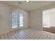 A bright room featuring tile floors and a door to the exterior at 6715 Biscayne Blvd, Rex, GA 30273