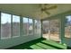 A sunroom extends to an outdoor patio and a yard at 6715 Biscayne Blvd, Rex, GA 30273