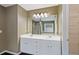 This bathroom has double sinks, a large mirror, and access to a walk-in closet at 950 Mill Creek Ave, Canton, GA 30115