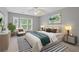 Bedroom features a ceiling fan and lots of natural light at 950 Mill Creek Ave, Canton, GA 30115