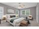Bedroom features a ceiling fan, good light and large bed at 950 Mill Creek Ave, Canton, GA 30115