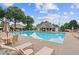 Community pool area with lounge chairs and a covered pavilion for relaxation and shade at 950 Mill Creek Ave, Canton, GA 30115