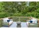 Relaxing deck area surrounded by lush greenery with comfortable seating at 950 Mill Creek Ave, Canton, GA 30115