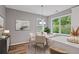 Bright dining area with a round table and plenty of natural light from the large window at 950 Mill Creek Ave, Canton, GA 30115