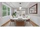 Dining room with hardwood floors, a modern chandelier, and ample natural light at 950 Mill Creek Ave, Canton, GA 30115