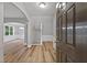 Welcoming foyer featuring hardwood floors, fresh paint, a staircase and arched doorways at 950 Mill Creek Ave, Canton, GA 30115
