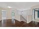 Upstairs hallway with hardwood floors and pendant lighting at 950 Mill Creek Ave, Canton, GA 30115