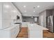 Spacious kitchen with white cabinets, stainless steel appliances, and a central island at 950 Mill Creek Ave, Canton, GA 30115