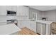 Kitchen with modern white cabinets, stainless steel appliances, and plenty of counter space at 950 Mill Creek Ave, Canton, GA 30115