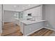 Bright kitchen featuring white cabinets, stainless steel appliances, and quartz countertops at 950 Mill Creek Ave, Canton, GA 30115