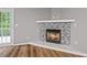 Living room fireplace with corner design is a main feature at 950 Mill Creek Ave, Canton, GA 30115