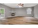 Open living room boasts wood floors and a fireplace at 950 Mill Creek Ave, Canton, GA 30115