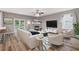 Staged living room shows the fireplace and lots of natural light at 950 Mill Creek Ave, Canton, GA 30115