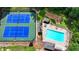 An aerial shot of the tennis courts, swimming pool, and playground in this lovely community at 9585 Fenbrook Ct, Johns Creek, GA 30022