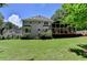 Spacious backyard featuring a screened porch and well-maintained lawn at 9585 Fenbrook Ct, Johns Creek, GA 30022