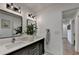 Bathroom featuring a double vanity with modern fixtures and decor at 9585 Fenbrook Ct, Johns Creek, GA 30022