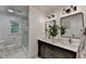 Updated bathroom featuring a double vanity, modern fixtures, and a glass-enclosed shower at 9585 Fenbrook Ct, Johns Creek, GA 30022