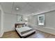 Modern bedroom with a comfortable bed, natural light, and minimalist decor at 9585 Fenbrook Ct, Johns Creek, GA 30022