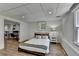 Another bedroom including a table in the background at 9585 Fenbrook Ct, Johns Creek, GA 30022