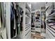 Walk-in closet with custom shelving provides ample storage and organization at 9585 Fenbrook Ct, Johns Creek, GA 30022
