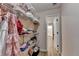 Walk in closet with wire shelving and visible clothing at 9585 Fenbrook Ct, Johns Creek, GA 30022