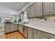 Neutral kitchen with shaker cabinets, stainless steel appliances, and wood flooring at 9585 Fenbrook Ct, Johns Creek, GA 30022
