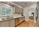 Kitchen features stainless steel appliances, shaker cabinets, and an eat-in breakfast area at 9585 Fenbrook Ct, Johns Creek, GA 30022