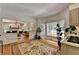 Open floor plan, connecting the kitchen and the living room, with plenty of natural light at 9585 Fenbrook Ct, Johns Creek, GA 30022