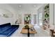 Serene sitting room with French doors, bookshelves, and views to the yard at 9585 Fenbrook Ct, Johns Creek, GA 30022