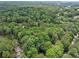 Stunning aerial view of the property surrounded by lush greenery and mature trees in a serene neighborhood at 2356 Sherbrooke Ne Dr, Atlanta, GA 30345