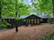 Back exterior view of the home showcasing the expansive backyard, mature trees and inviting outdoor space at 2356 Sherbrooke Ne Dr, Atlanta, GA 30345