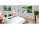 Bedroom with green accent pillows, natural light from the window, and a dresser with light wood finish at 2356 Sherbrooke Ne Dr, Atlanta, GA 30345