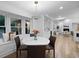 Bright breakfast nook with a bay window seat and a marble-topped round table next to the open kitchen at 2356 Sherbrooke Ne Dr, Atlanta, GA 30345