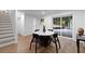 Dining area with a marble-topped table and modern chairs adjacent to the staircase and the door at 2356 Sherbrooke Ne Dr, Atlanta, GA 30345