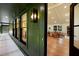 Green exterior with black trim, offering views of the open-plan living area, and patio at 2356 Sherbrooke Ne Dr, Atlanta, GA 30345