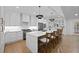 Bright kitchen featuring stainless appliances, a center island with bar seating and herringbone backsplash at 2356 Sherbrooke Ne Dr, Atlanta, GA 30345