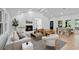 Bright living room features a white brick fireplace, hardwood floors, and a dining area at 2356 Sherbrooke Ne Dr, Atlanta, GA 30345