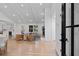 Open-plan living and dining area with cathedral ceilings, hardwood floors, and modern decor at 2356 Sherbrooke Ne Dr, Atlanta, GA 30345