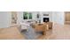 Living area with hardwood floors, fireplace, modern seating, and natural light at 2356 Sherbrooke Ne Dr, Atlanta, GA 30345